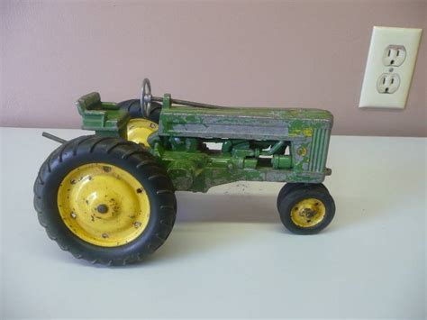original vintage 1950 s john deere toy tractor with metal rims see
