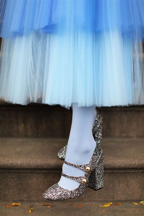 blair eadie wearing a neon blue tulle skirt with colored tights no 21 shoes and a balmain