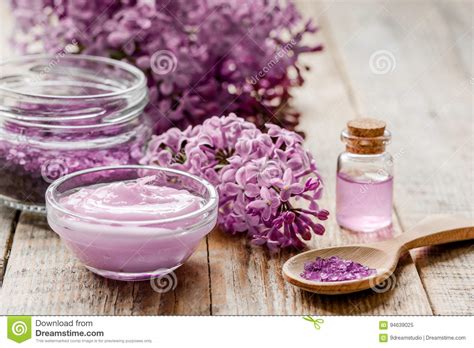 lilac cosmetics  flowers  spa set  wooden table background