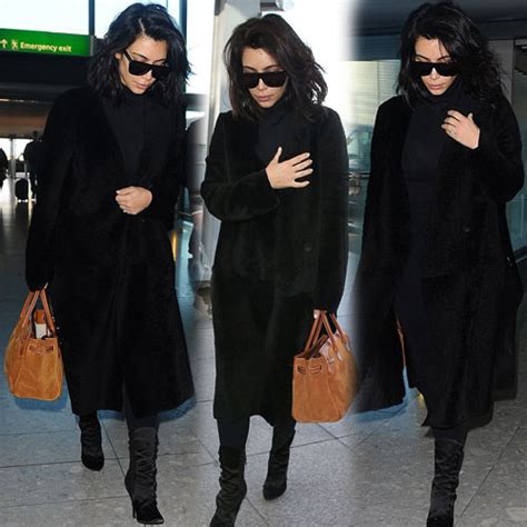 Kim Again Sizzles In All Black Outfit Slide 1