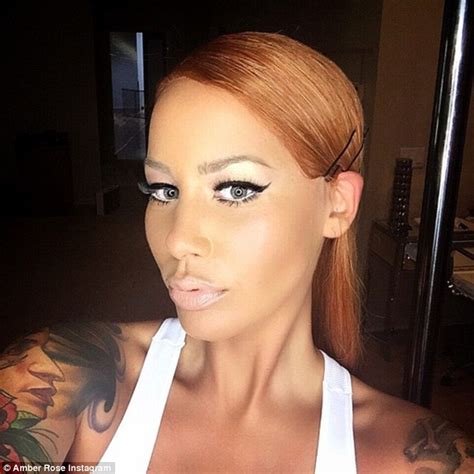 Amber Rose Is Nearly Unrecognizable As She Tries On A Long Red Wig