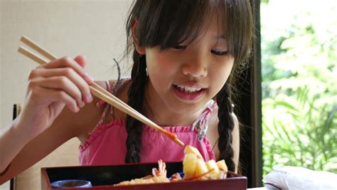 asian girl eating japanese food stock footage video 100 royalty free 17427385 shutterstock