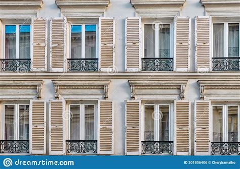 street view  traditional french windows  shutters  wrought iron railings  paris