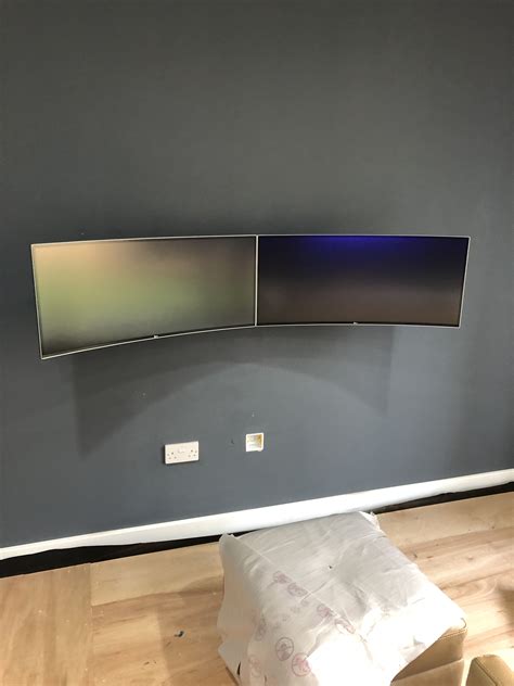 dual wall mounted curved ultrawide monitors  view gaming room vrogue