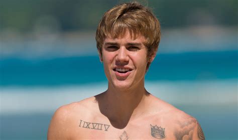 justin bieber goes shirtless at the beach with visible