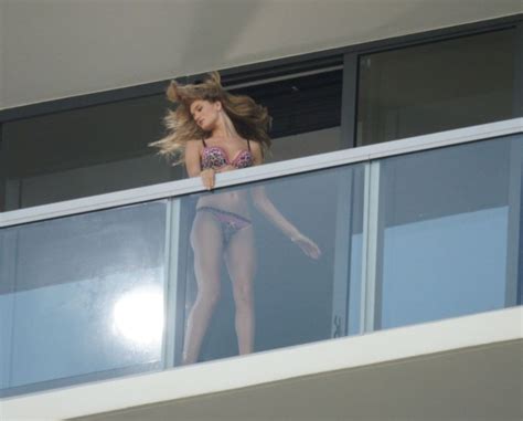 rosie huntington whiteley topless lingerie candids on a balcony