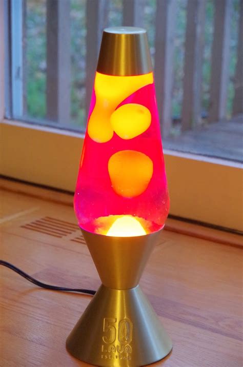 a colorful lamp sitting on top of a wooden table
