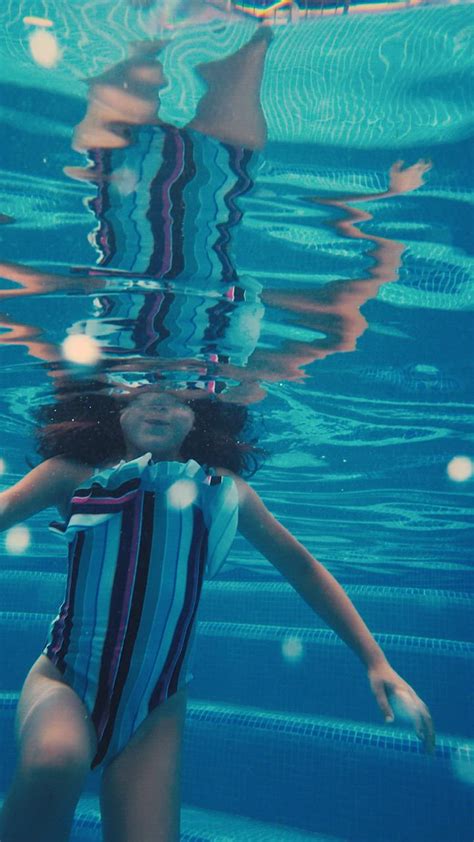 girl underwater in a pool free stock video mixkit