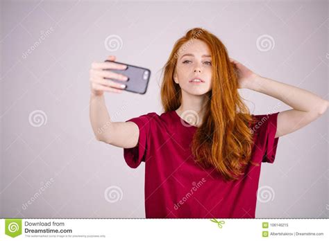 redhead girl takes a selfie she has long red hair wears marsala t shirt stock image image of