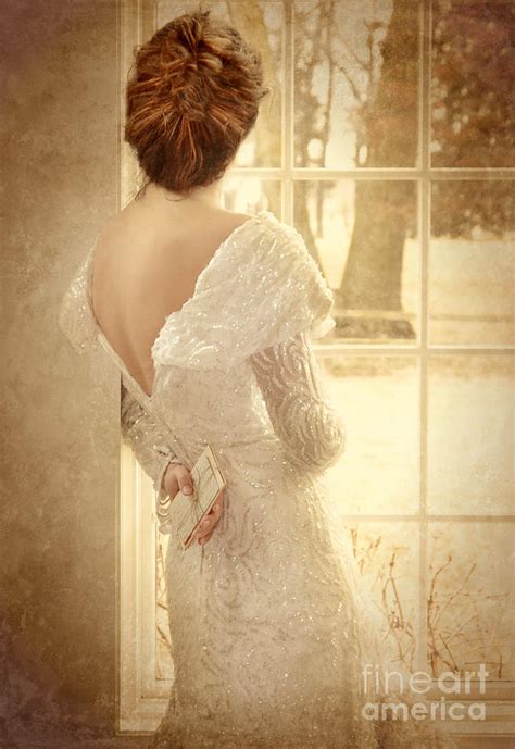 beautiful lady in sequin gown looking out window