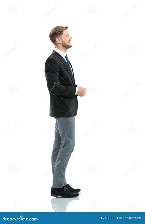 side view   smiling businessman standing  white backgroun stock