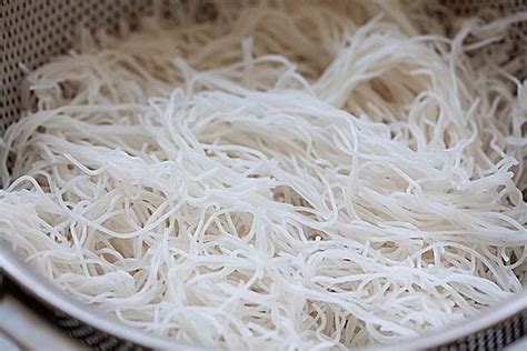 rice sticks in a colander ready for stir frying with