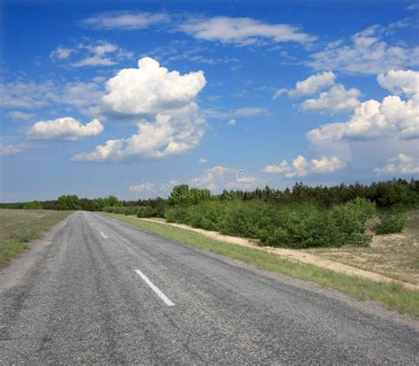 empty road stock photo image  clouds fast movement