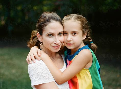 mother and daughter embracing by stocksy contributor jakob
