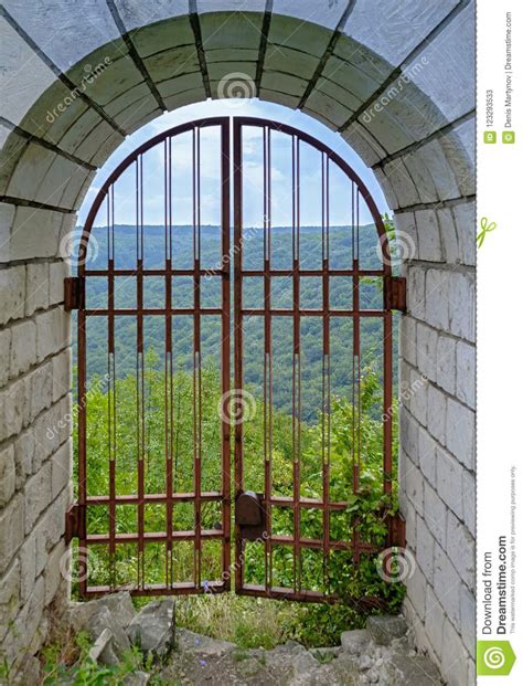 iron gate   ruined fortress stock image image  entrance house
