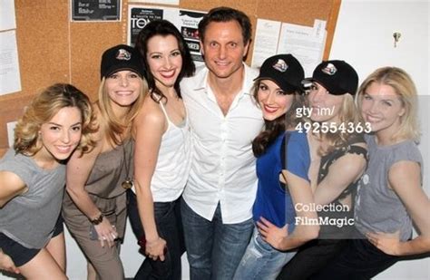 tony goldwyn poses with the chorus girls backstage at the hit musical