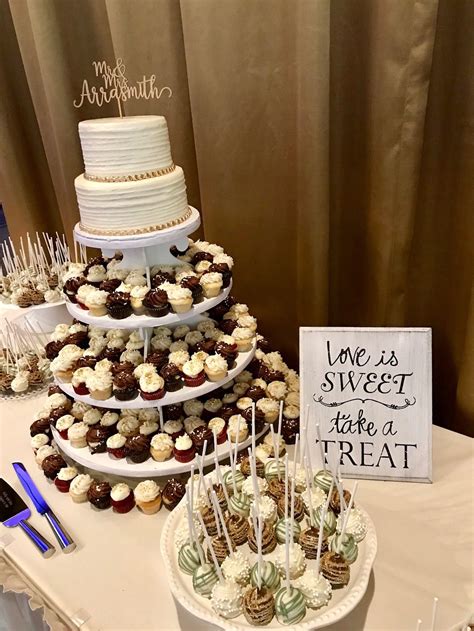 Wedding Dessert Table With Mini Cupcakes Cake Pops And A 2 Tier Cake