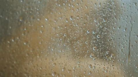 woman taking shower in bathroom with steamy weeping glass wall — stock