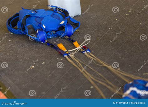 blue parachute folded    ground stock image image  parachute outdoor