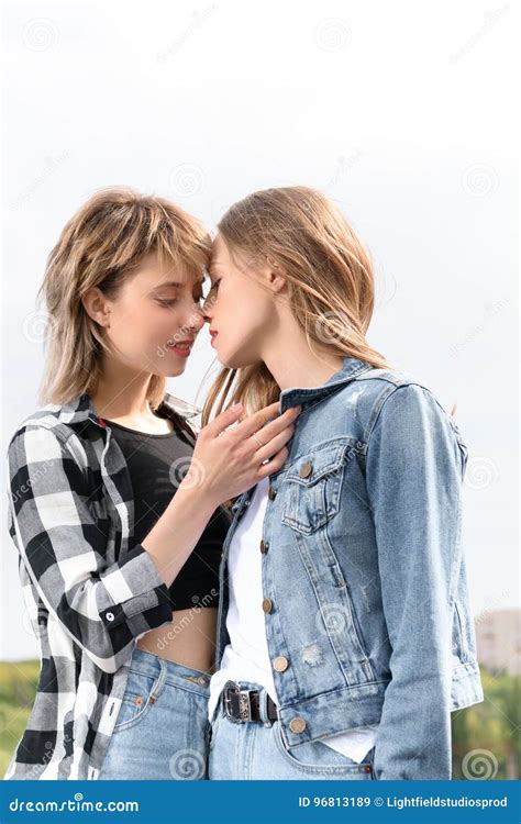 Lesbian Couple Kissing With Eyes Closed Outdoors Stock Image Image Of