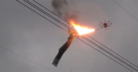 chinese flame throwing drone removes net  powerlines ftw video ebaums world