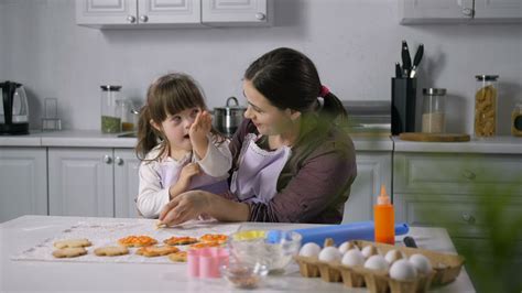 mother teaching her daughter to cook free stock video