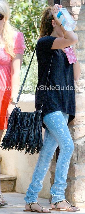 ashley tisdale wearing jet by john eshaya splatter skinny jeans mystique jeweled sandals bag