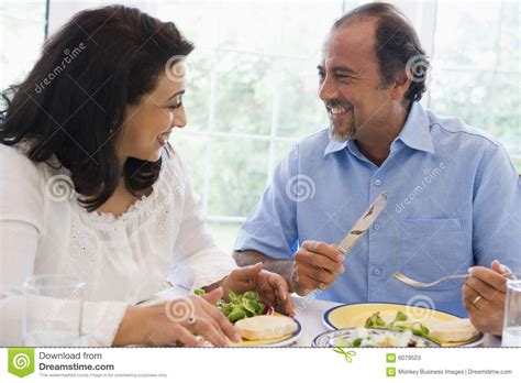 a middle eastern couple enjoying a meal together stock