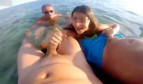 italian girl sucks two cocks in a public beach reblop