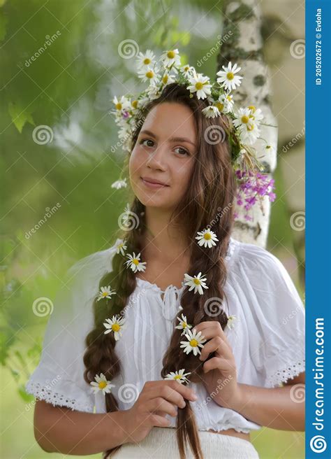 Young Beautiful Brunette Girl In White Near The Birch With A Wreath Of