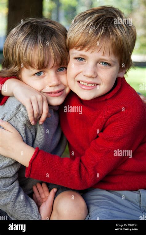 young boys hugging   stock photo alamy