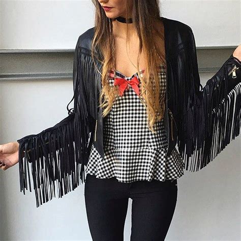 woman  long hair wearing  black  white checkered shirt red bow tie  fringe jacket