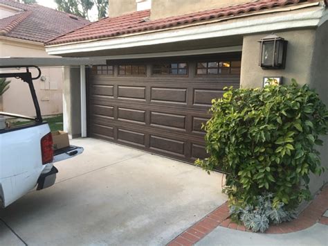 chi walnut color garage door installed  irvine cityscape garage doors garage doors