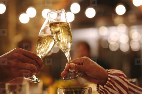 couple toasting champagne glasses  party stock photo
