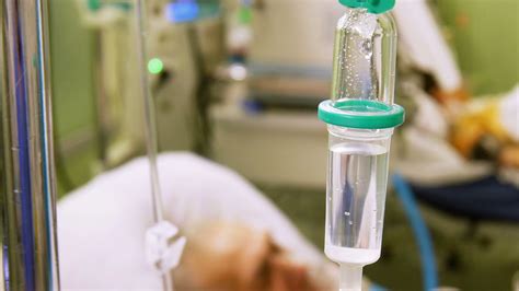 intravenous drip in icu with patient on background stock video footage