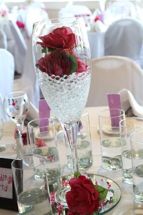 Champagne Glasses With Flowers And Floating Candles Would Love