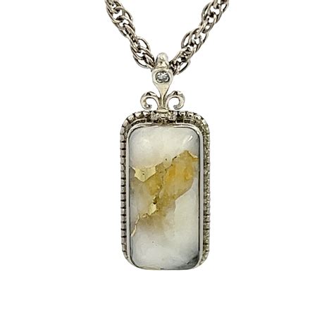 white gold fleur de lis gold quartz pendant gw alaska mint