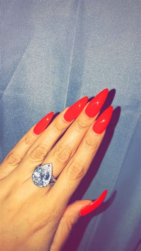 ferrari red red nails dnd gel polish stiletto nails long nails sunset ring ring boujee mine in