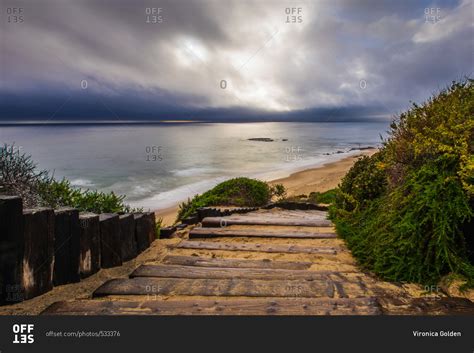 wooden steps leading  beach stock photo offset