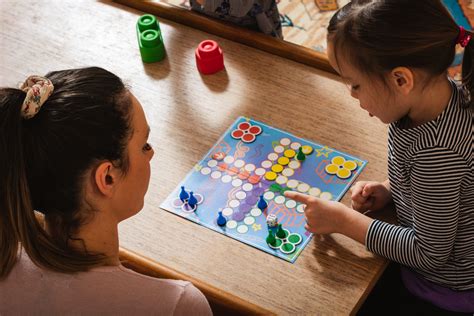 family playing board game  home calculate