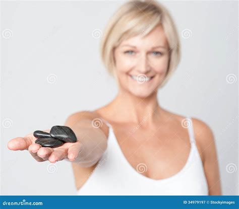woman showing polished spa stones stock image image  beauty