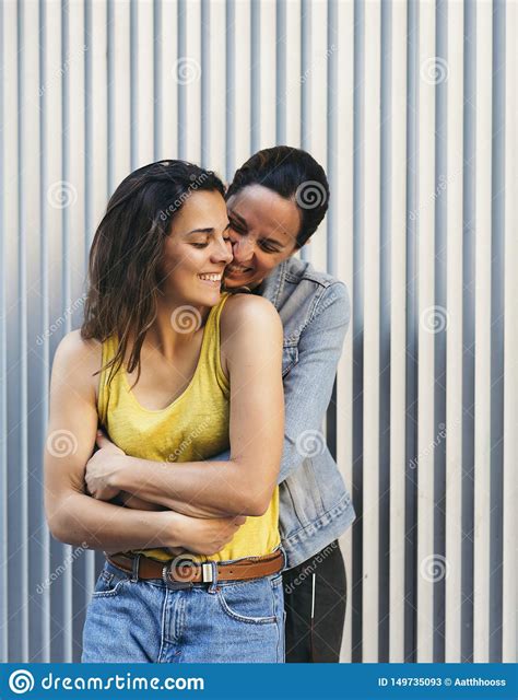 pretty girl couple hugging each other and smiling