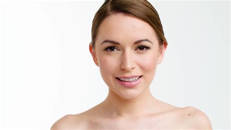 beautiful healthy smiling woman with fresh skin of face over white background stock footage