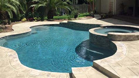 raised spas  flagstone offer stunning finishing touches  pools