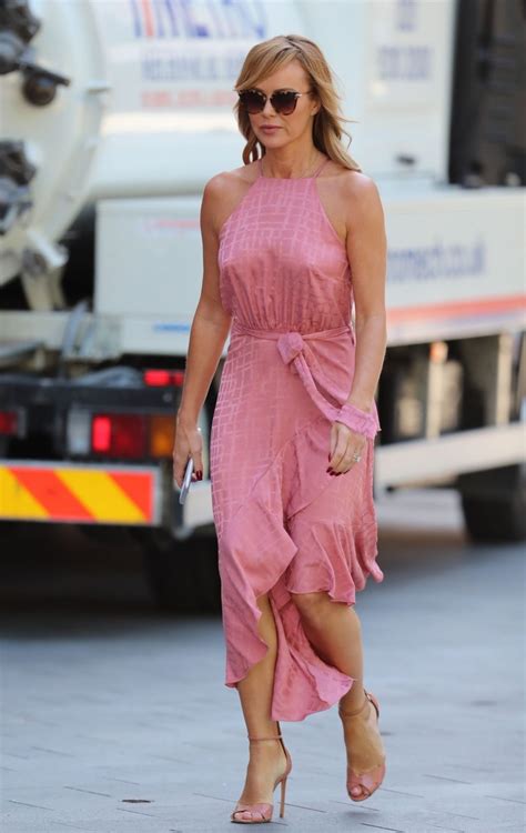 amanda holden is pictured while leaving the heart radio
