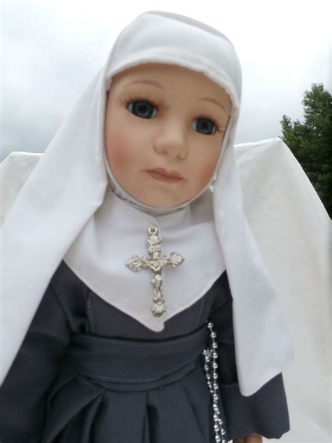 sister of mercy nun doll porcelain catholic collectible in gray habit