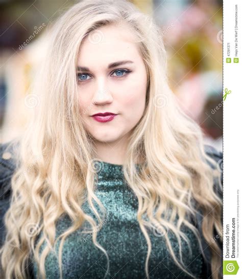 Portrait Of A Beautiful Blond Blue Eyed Teenage Girl In