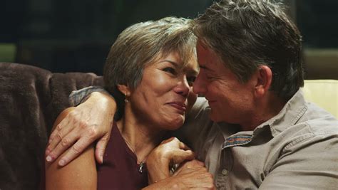 Couple In Bed During Intimate Moment Before Going To Sleep