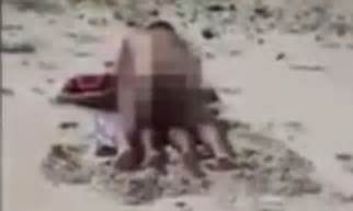 video shows a couple having sex on a public beach in