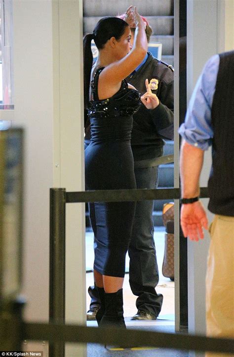 kim kardashian strips off fur coat for jfk airport body scan again daily mail online
